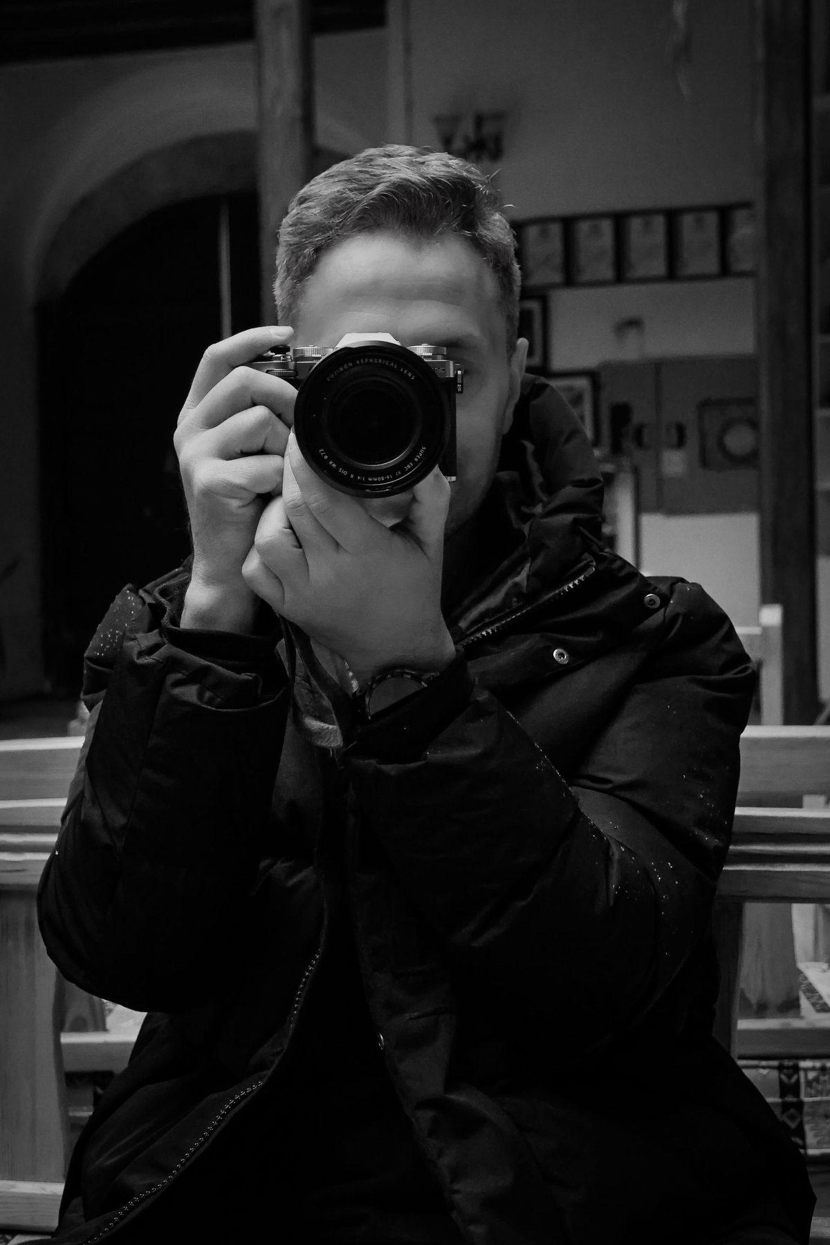 Original photo of a photographer behind his camera