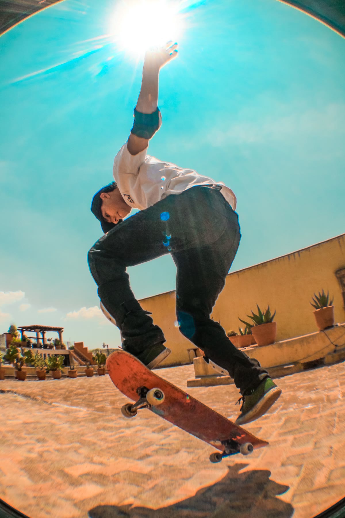 Original photo of a skateboarder mid-trick